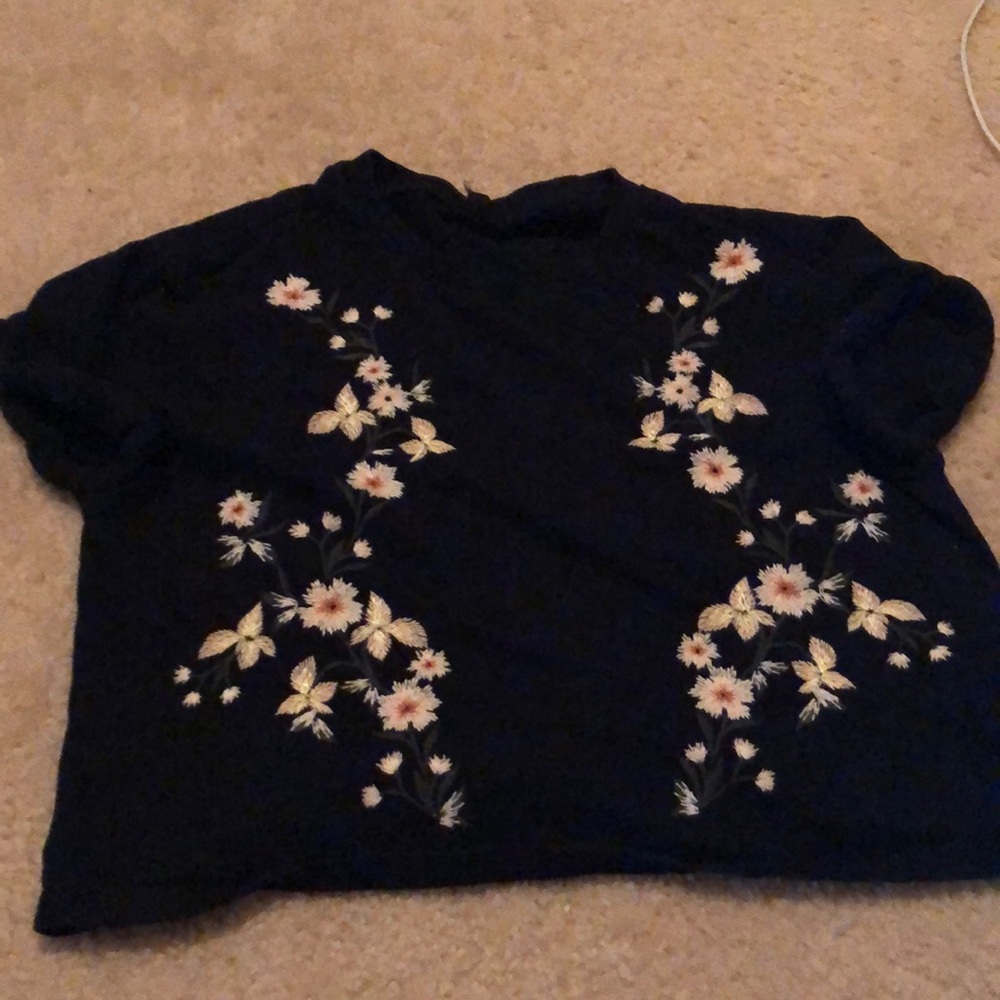 Black shirt with embroidered white flowers